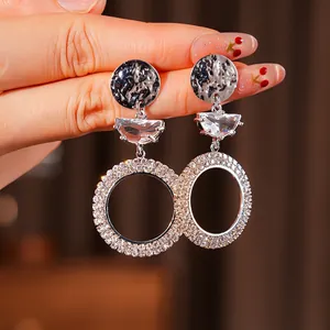 Silver drop earrings with crystal trapezoid and large rhinestone-encrusted circles