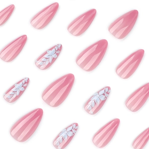 Pink cat-eye press-on nails in long almond shape with elegant white floral patterns