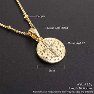 Detail of 12mm gold plated cross pendant necklace with AAA cubic zirconia on black background