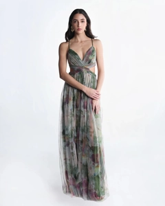 Close-up of green gradient floral print mesh fabric with intricate strap and cutout details