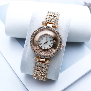 Luxury rose gold women's watch with floating rhinestones and mother of pearl dial