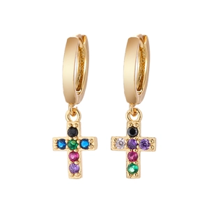 Detail of gold-plated hoop earrings with colorful cubic zirconia cross pendants