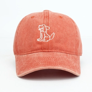 Close-up of vintage washed cotton baseball cap featuring detailed cartoon dog embroidery