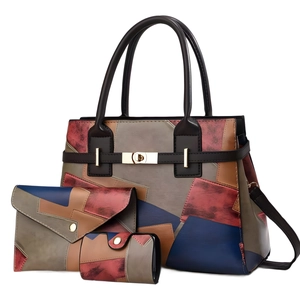 Three-piece patchwork handbag set with large tote, crossbody pouch, and wallet in brown and blue