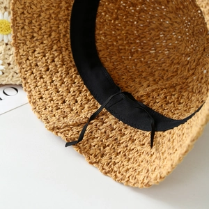 Macro shot of the adjustable inner sweatband and detailed woven texture of the straw hat