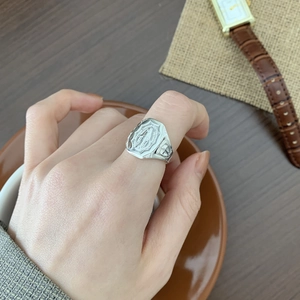 Detailed relief carving of Virgin Mary on a vintage S925 sterling silver signet ring