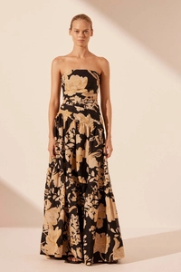 Detail of strapless high-waisted floral print maxi dress with large beige flower pattern