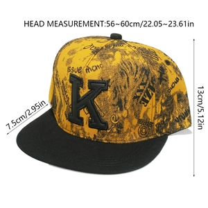 Close-up of graffiti print flat brim hip-hop cap with black embroidered letter K