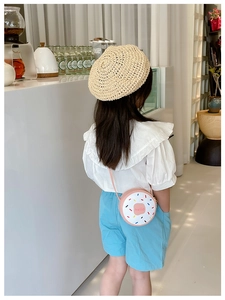 Pink and white donut-shaped crossbody bag for girls with Hello embroidery and cute charms