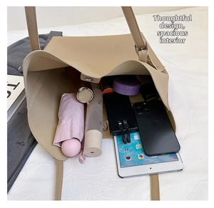 Spacious tote bag interior showing capacity for tablet, umbrella, and daily essentials