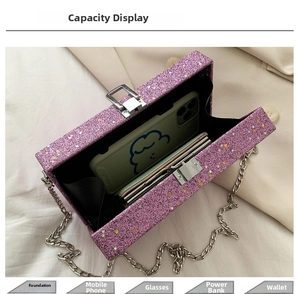 Top view of purple glitter box bag showing interior capacity for phone and cosmetics