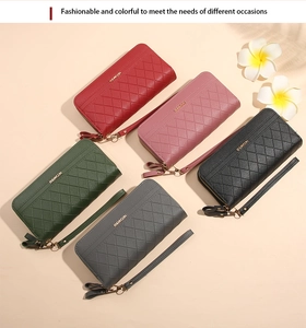Close-up of quilted long wallets for women in five colors with wristlets and metal logo