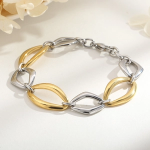 Detailed shot of two-tone gold and silver geometric chain bracelet with lobster clasp