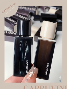 Close-up of Cappuvini brown velvet lip glaze in elegant black and off-white packaging