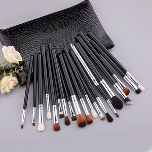 Macro view of 19pcs eye makeup brush set with black crocodile texture leather storage bag
