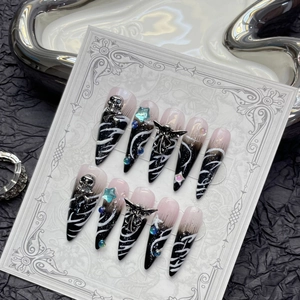 Handmade gothic stiletto press-on nails with black gradient, skull and cross charms