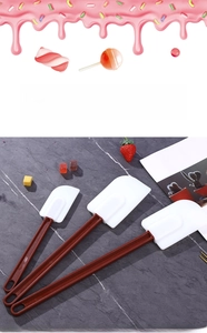 Three-piece heat-resistant silicone spatula set with ergonomic handles for baking needs