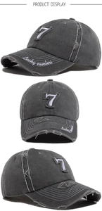 Three-way view of a distressed dark grey baseball cap with embroidery and patch detail