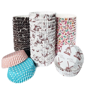 Variety of greaseproof paper cupcake liners with colorful polka dots and windmill patterns