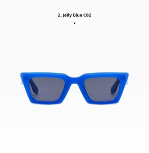 Detail view of retro cat-eye sunglasses featuring translucent jelly blue frames and dark lenses