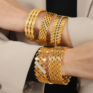Women's gold hollow titanium steel bangles with zircon inlay in various geometric designs