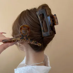 Vintage leopard print acetate hair claw set featuring geometric and spiral clip designs