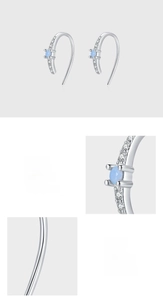 Detailed view of S925 sterling silver earrings featuring pavé setting and blue zircon