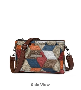 Side view detail of colorful patchwork faux crocodile and lychee leather shoulder bag