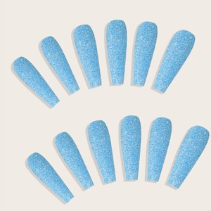 Detail view of 12 pieces long ballerina blue glitter press-on nails with sparkling texture