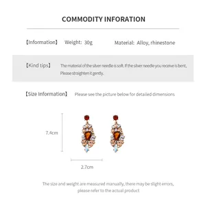 Detailed view of rhinestone geometric drop earrings showing 7.4cm length and 2.7cm width