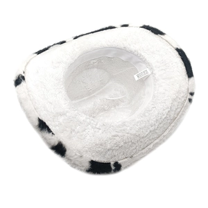 Detail of soft plush lining and care label inside a cow print cowboy hat