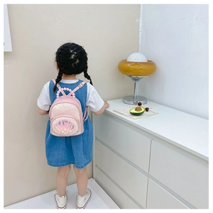 Detail of pink sequin toddler backpack with pearl handle and shell-shaped zipper pocket