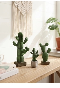 Detailed view of artificial resin cactus decor with natural textures on white background