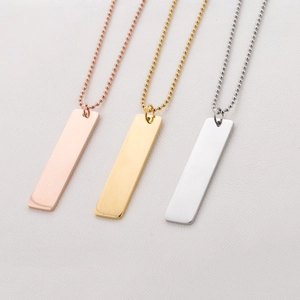 Detailed view of rectangular bar pendant necklaces in rose gold, gold and silver finishes