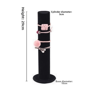 Detailed view of black velvet display stand showing 29cm height and 5cm barrel diameter