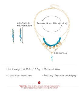 Detailansicht des 14K vergoldeten Boho-Schmucksets mit blauen Perlen und Wellenanhänger