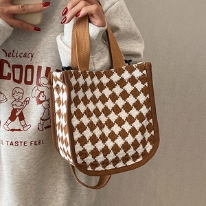 Classic brown and white houndstooth canvas tote bag with top handle and shoulder strap