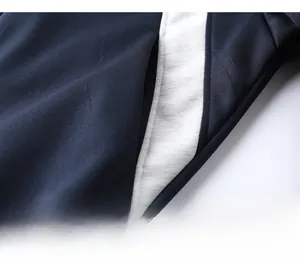 Close-up of hidden side pocket and high-quality stitching on navy sports jacket