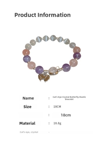 Detail of beaded bracelet with opal cat eye stones and crystal butterfly charm detail
