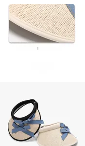 Macro view of stitching details on foldable straw sun hat with decorative bow