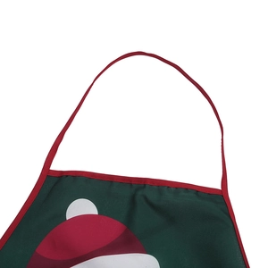 Detail of Christmas apron neck strap and red trim with a festive cartoon design