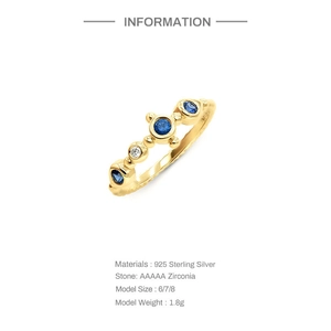 Detail of S925 sterling silver gold ring featuring blue opal and AAAAA zirconia stones