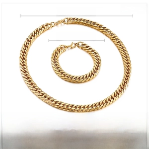 Macro detail of gold stainless steel cuban curb chain set with 11mm width specifications