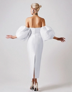 Detailed back view of white off-shoulder satin dress with puff sleeves and slit