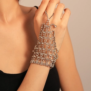 Macro detail of silver mesh hand chain with sparkling rhinestones covering the hand