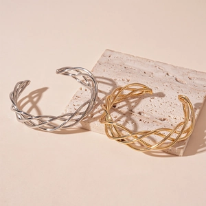 Modern gold and silver mesh twisted geometric open cuff bracelet on stone base