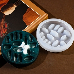 Macro shot of circular silicone resin mold with marble pattern ring holder tray