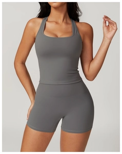 Detail of dark gray high-elastic sports bra and high-waist shorts set for fitness