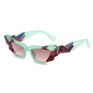 Irregular mint green cat eye sunglasses with colorful crystals and brown gradient lenses