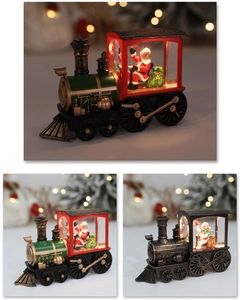 Close-up of vintage LED Christmas train lanterns featuring Santa and snowman figures